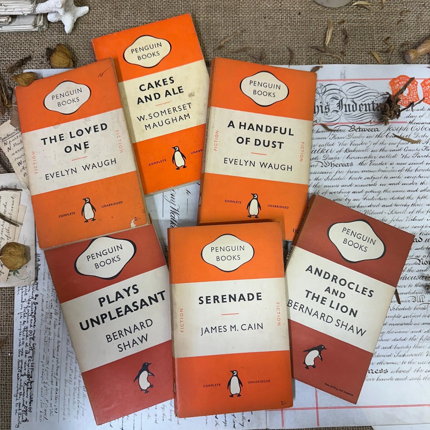 Stack of Orange Vintage Penguin books - The Blind Mole