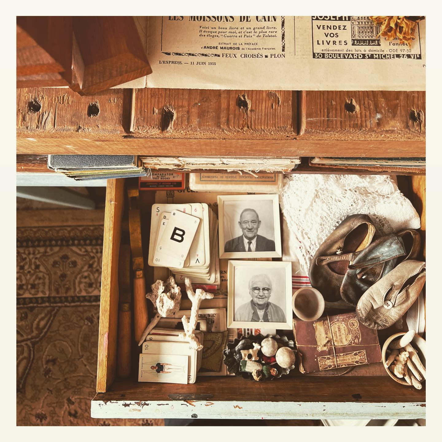 collection of vintage items arranged in an open drawer