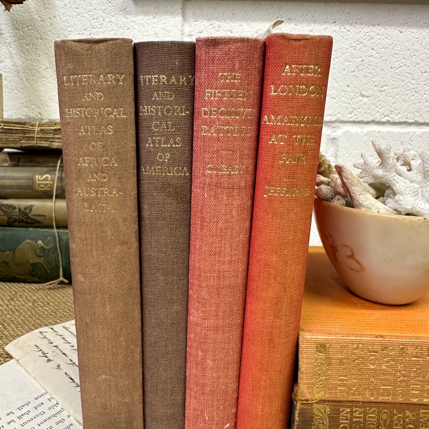 Coloured Book Stack Red Tones - The Blind Mole