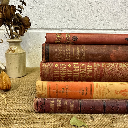 Stack of Red Orange Coloured Books