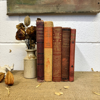 Stack of Red Orange Coloured Books