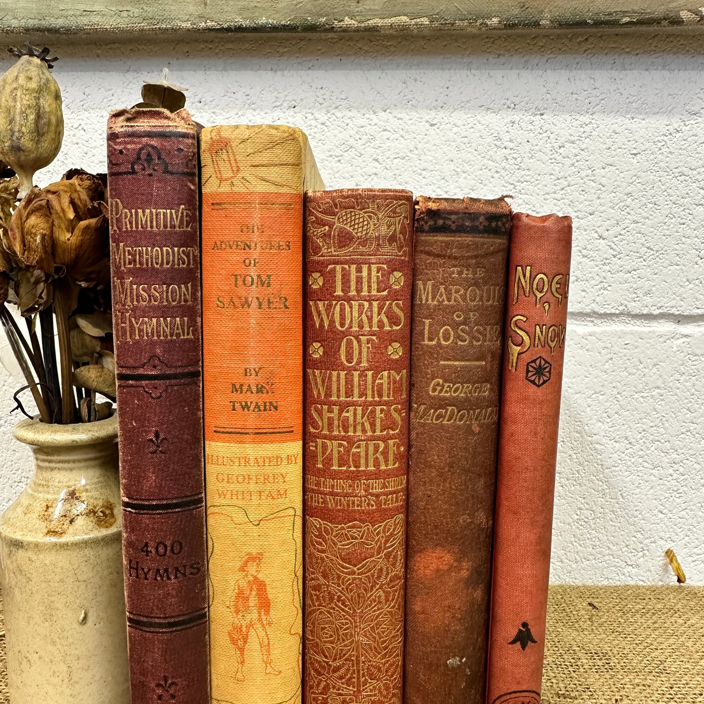 Stack of Red Orange Coloured Books