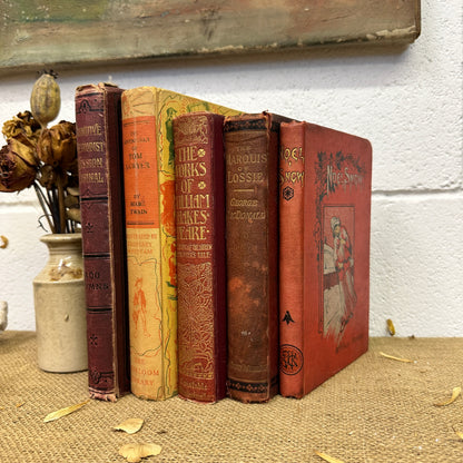Stack of Red Orange Coloured Books