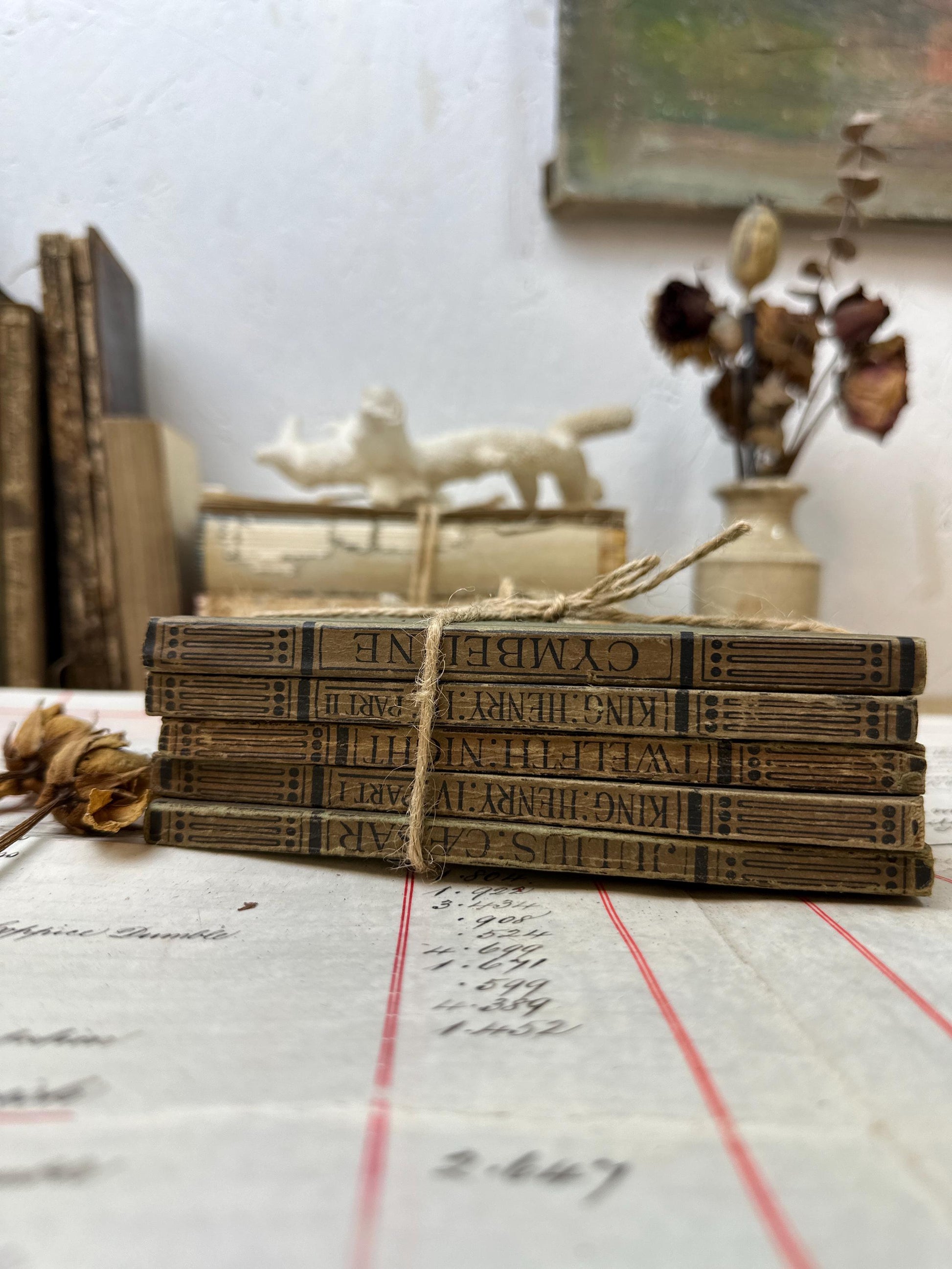 Stacks of Antique Green Paper Backed Books The Works of William Shakespeare JM Dent